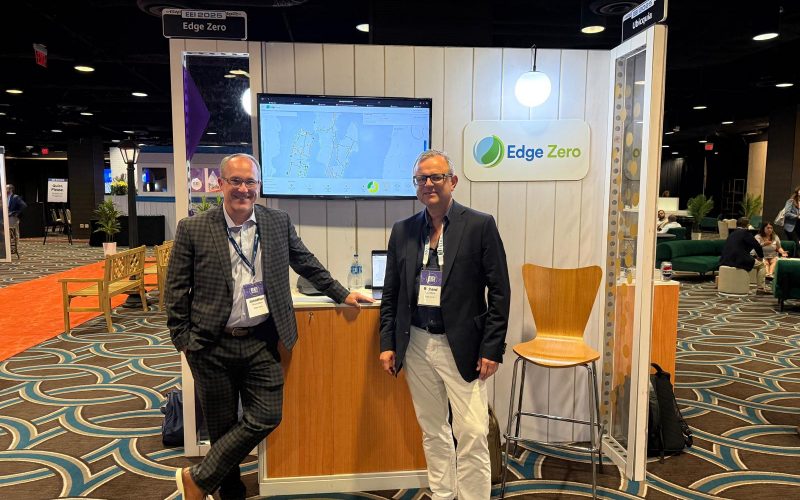 CRO J.T. and CEO Richard stand at the EdgeConnected booth